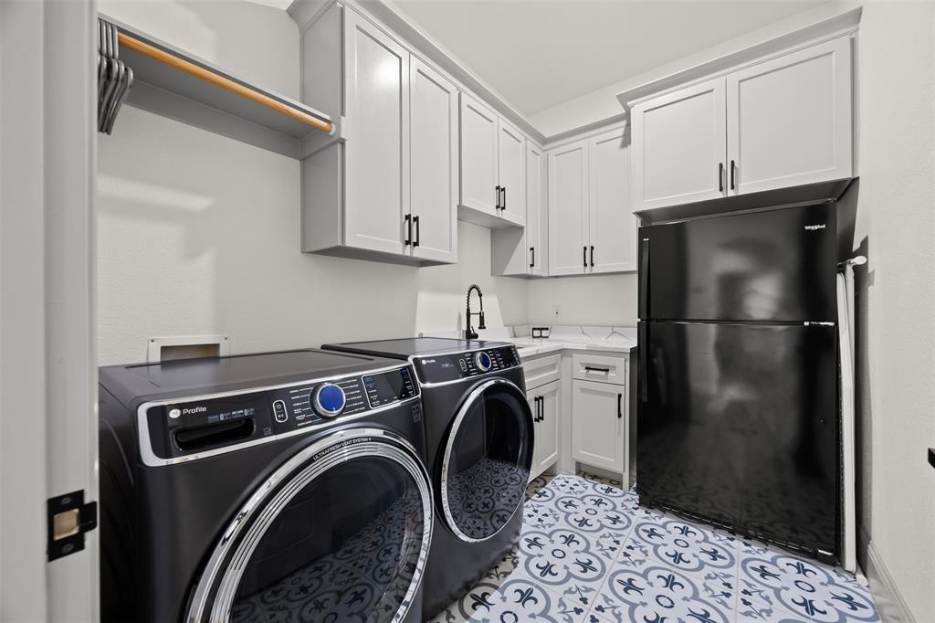 6317 Vega Road Godley, TX 76044 - Photo 24 of 27 a utility room with dryer and washer
