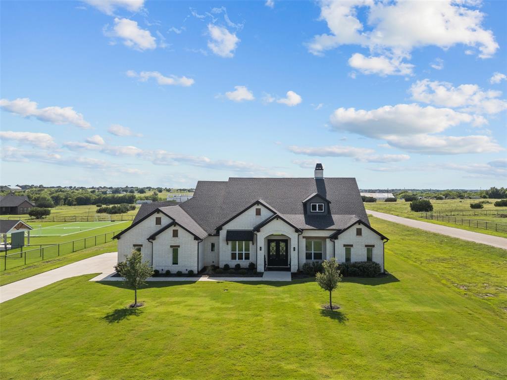 6317 Vega Road Godley, TX 76044 - Photo 3 of 28 a house view with a garden space
