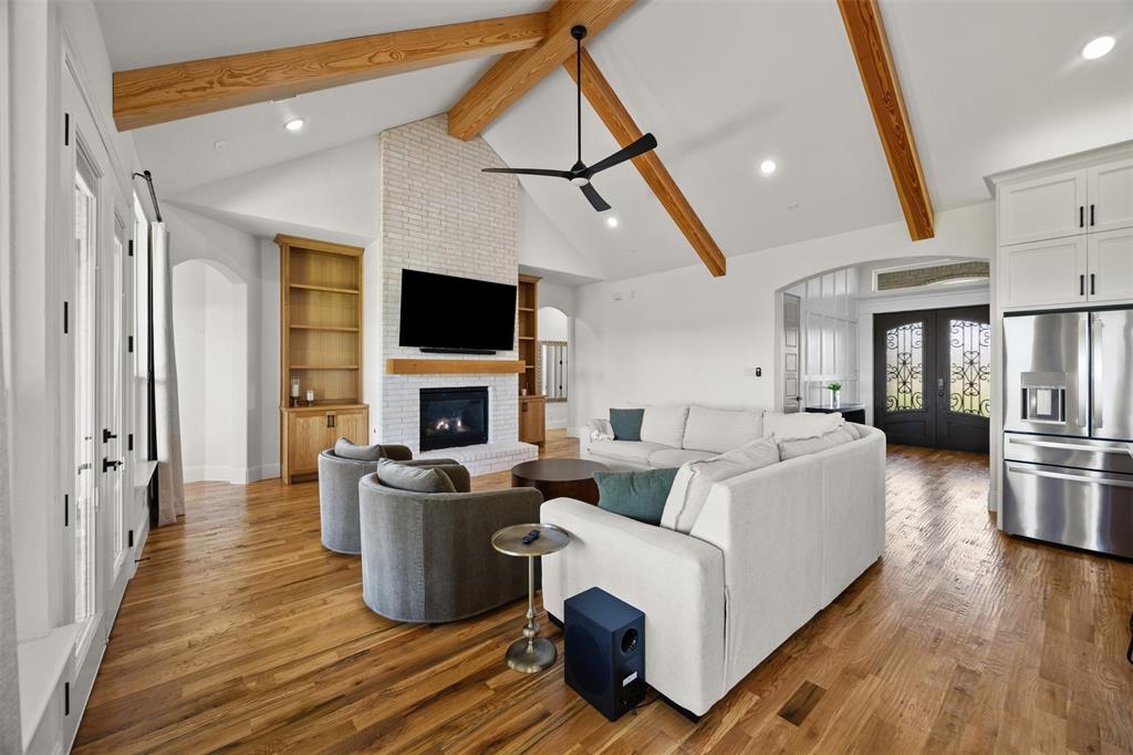 6317 Vega Road Godley, TX 76044 - Photo 7 of 28 a living room with fireplace furniture and a flat screen tv