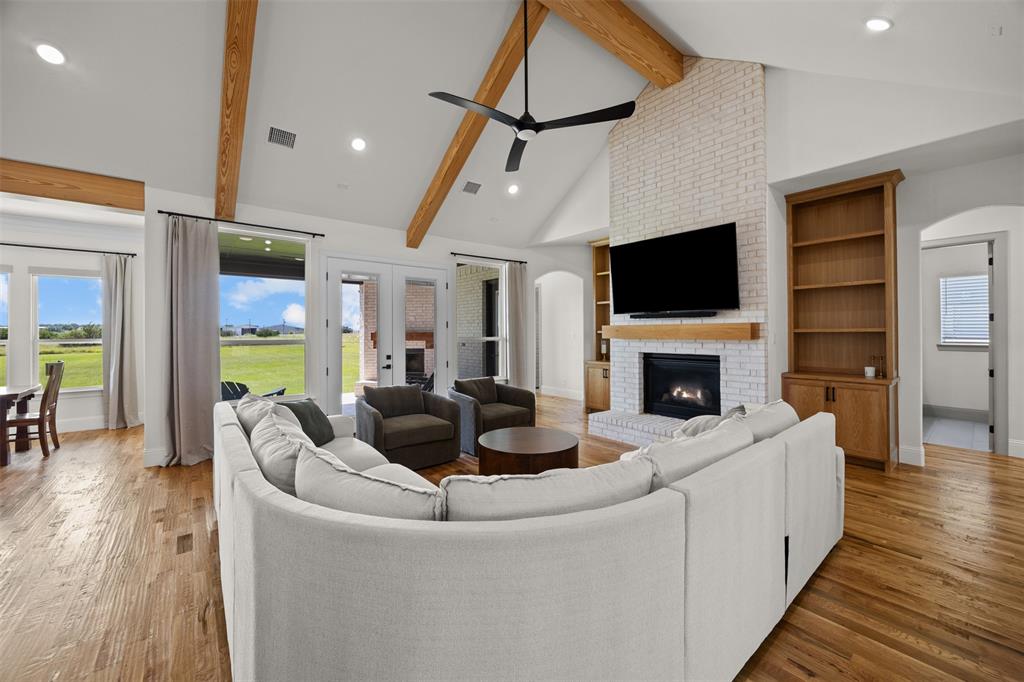 6317 Vega Road Godley, TX 76044 - Photo 8 of 28 a living room with fireplace furniture and a flat screen tv