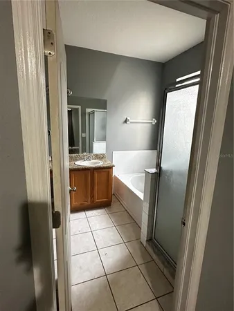 a bathroom with a sink a mirror and a bathtub