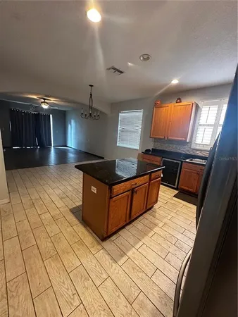 a kitchen with stainless steel appliances granite countertop a sink and cabinets
