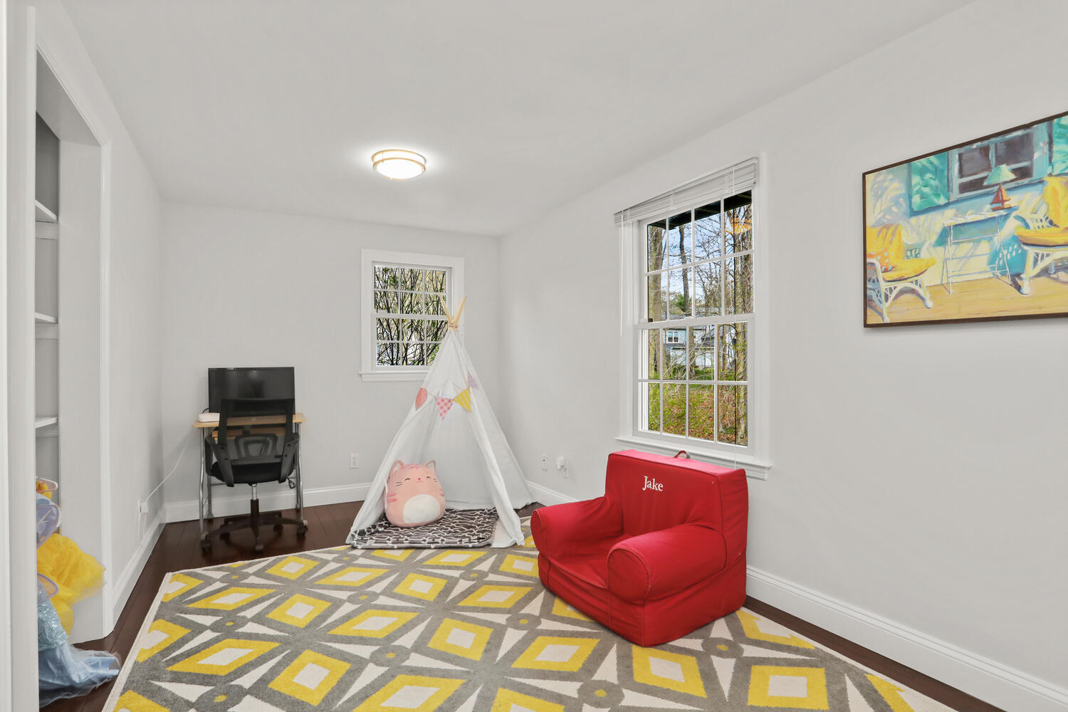 86 West Avenue Darien, CT 06820 - Photo 12 of 32 a living room with furniture and a flat screen tv