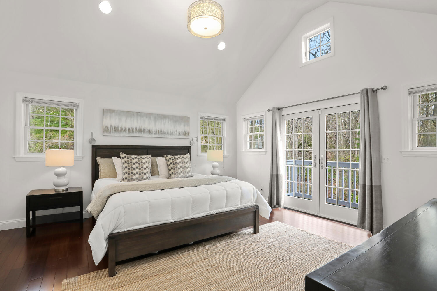 86 West Avenue Darien, CT 06820 - Photo 16 of 32 a bedroom with a large bed and a window