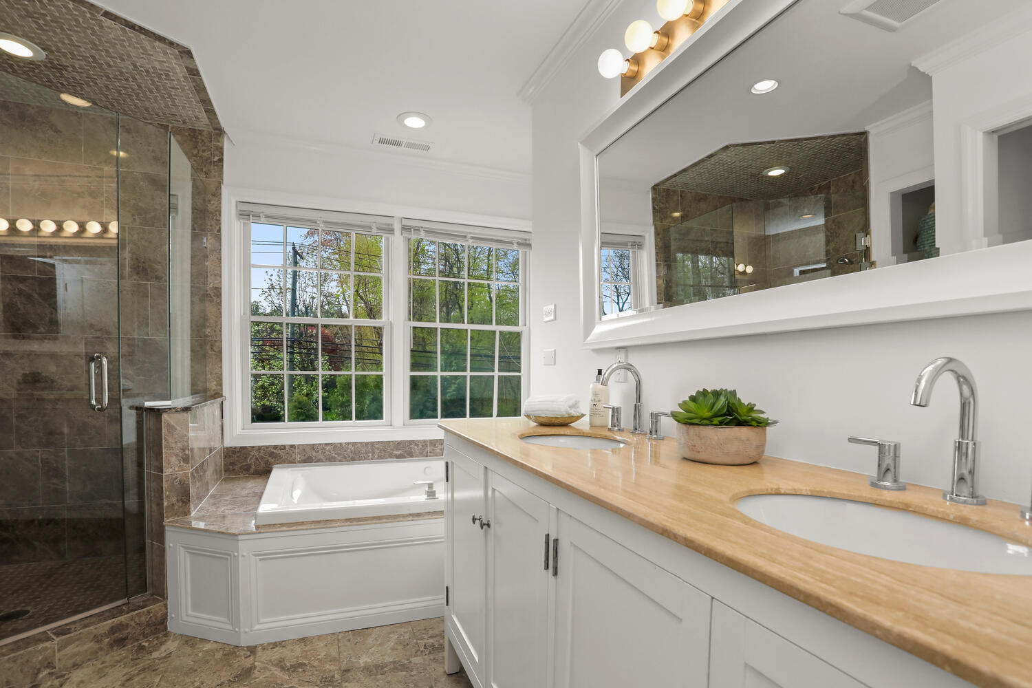 86 West Avenue Darien, CT 06820 - Photo 18 of 32 a bathroom with a granite countertop sink mirror and bathtub
