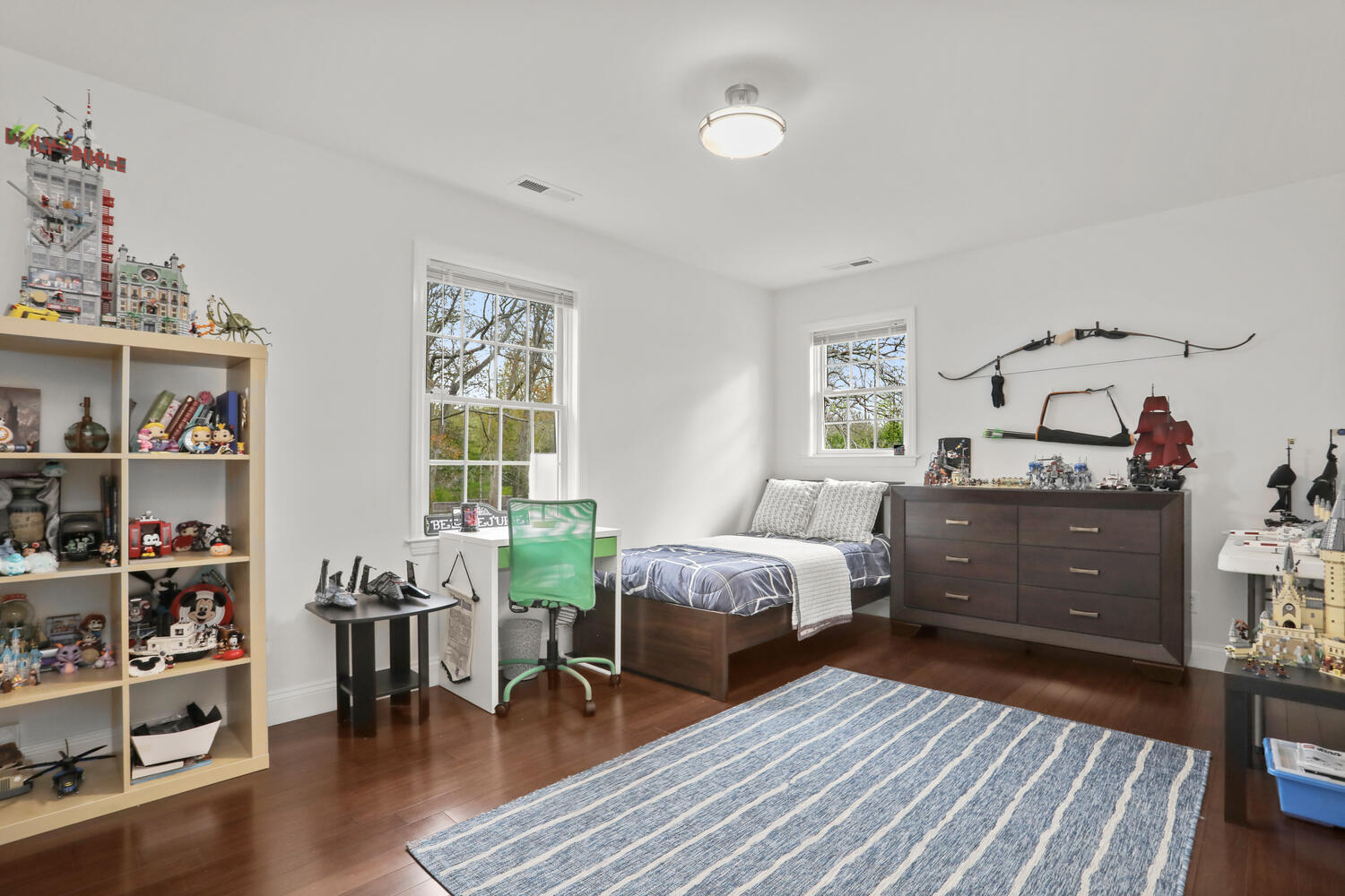 86 West Avenue Darien, CT 06820 - Photo 20 of 32 a bedroom with furniture and a wooden floor