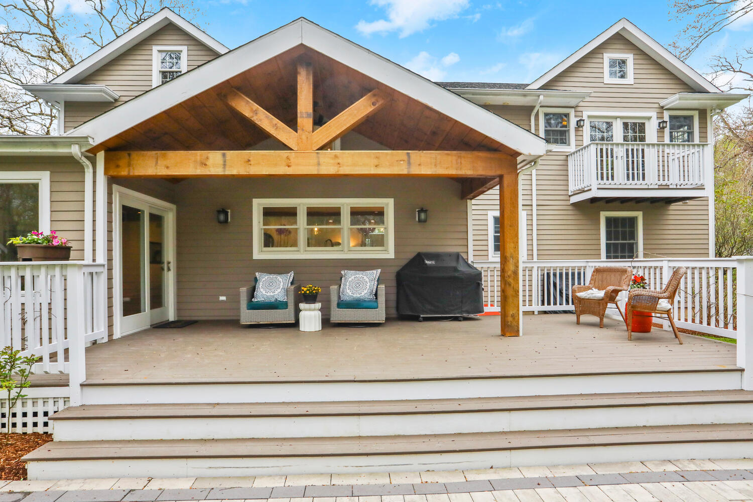 86 West Avenue Darien, CT 06820 - Photo 25 of 32 a view of a house with a small deck and couches chairs