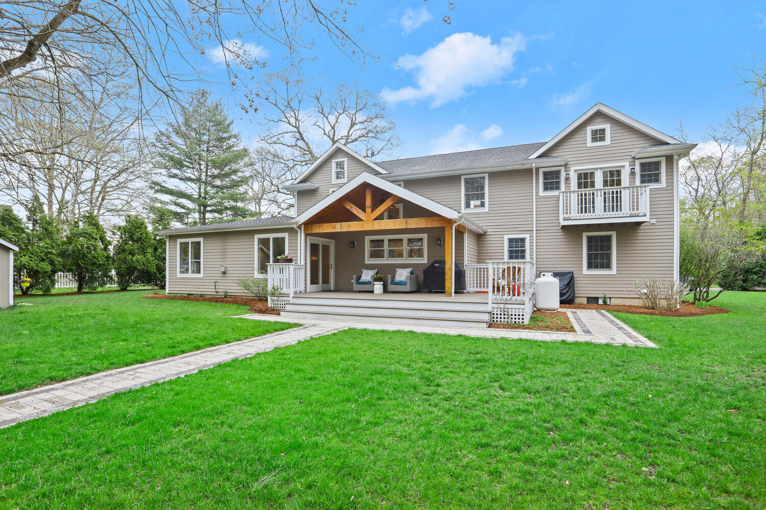 86 West Avenue Darien, CT 06820 - Photo 28 of 32 a front view of house with backyard and green space