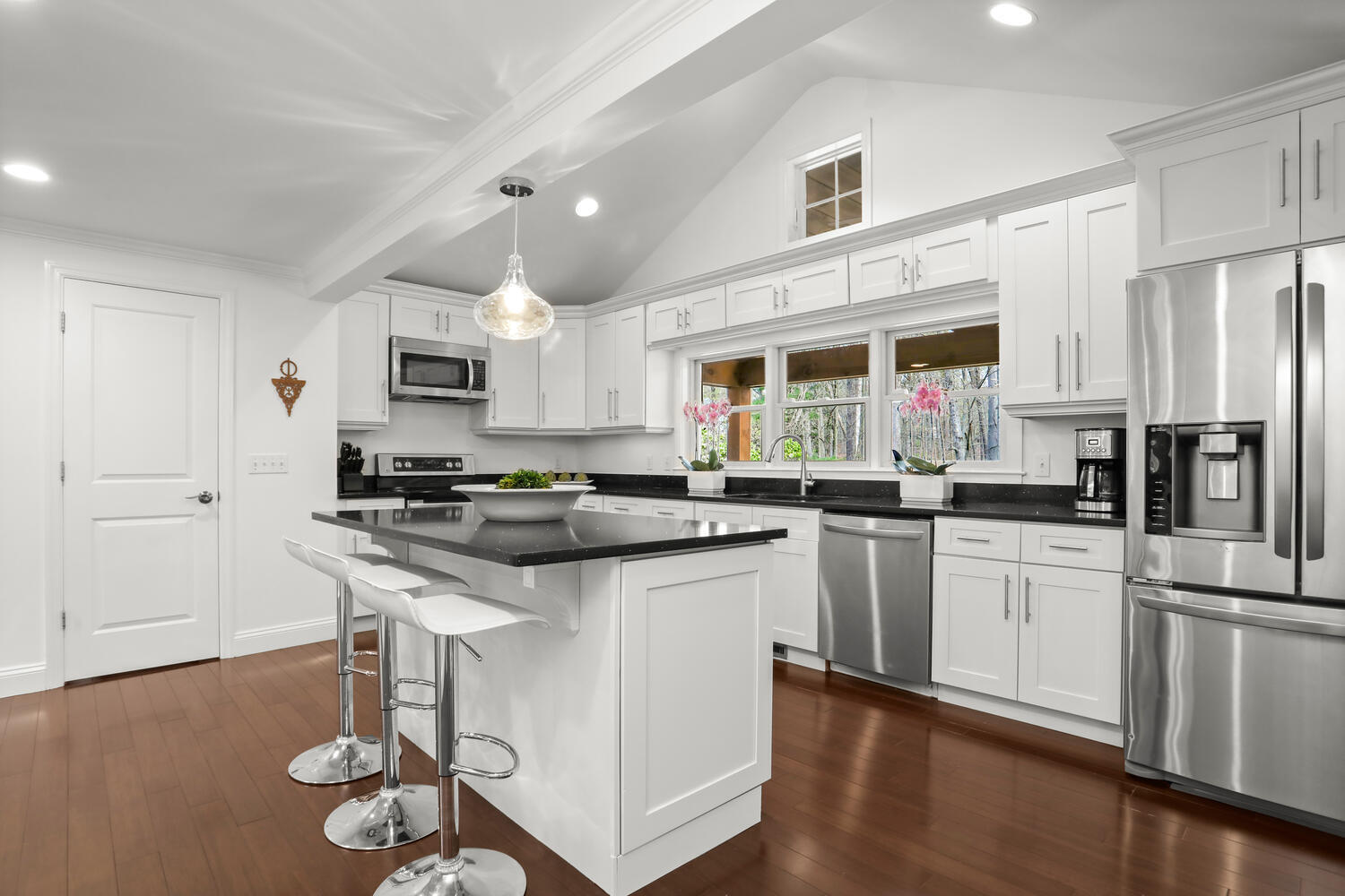 86 West Avenue Darien, CT 06820 - Photo 7 of 32 a kitchen with stainless steel appliances a stove a sink dishwasher a refrigerator and white cabinets with wooden floor