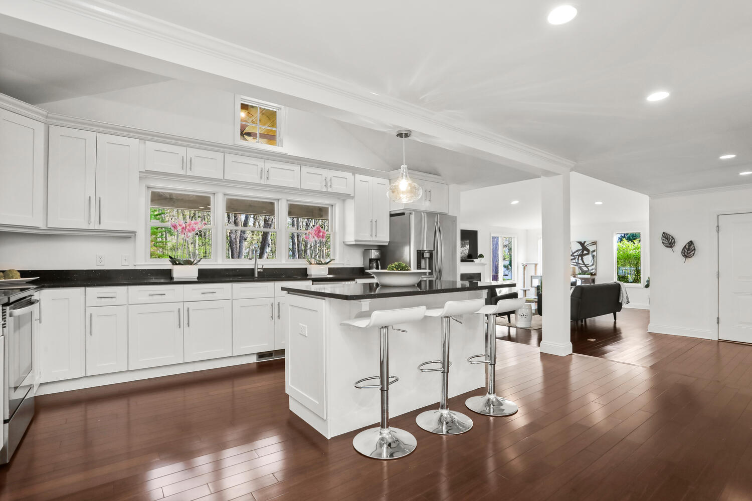 86 West Avenue Darien, CT 06820 - Photo 8 of 32 a kitchen with stainless steel appliances granite countertop a sink cabinets and wooden floor