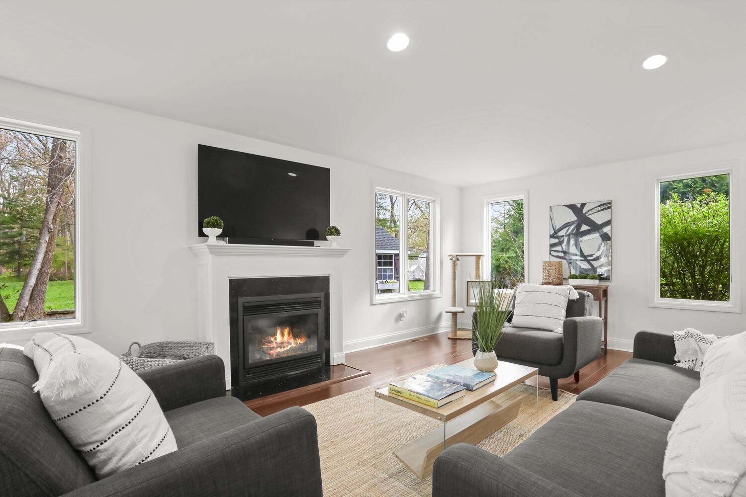 86 West Avenue Darien, CT 06820 - Photo 9 of 32 a living room with furniture a flat screen tv and a fireplace