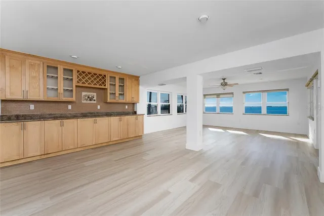a kitchen with a sink cabinets and stainless steel appliances