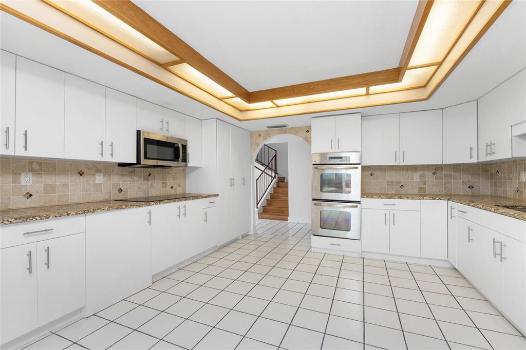 341 Severin Road Southeast Port Charlotte, FL 33952 - Photo 27 of 90 a kitchen with a sink cabinets and stainless steel appliances