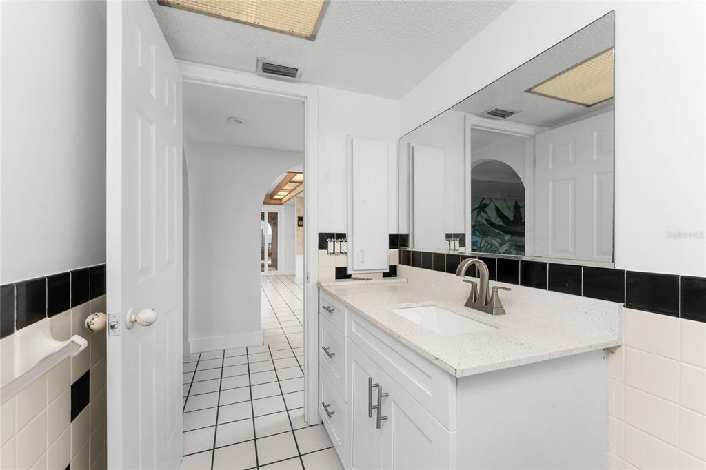 341 Severin Road Southeast Port Charlotte, FL 33952 - Photo 33 of 90 a large white kitchen with a sink and washing machine