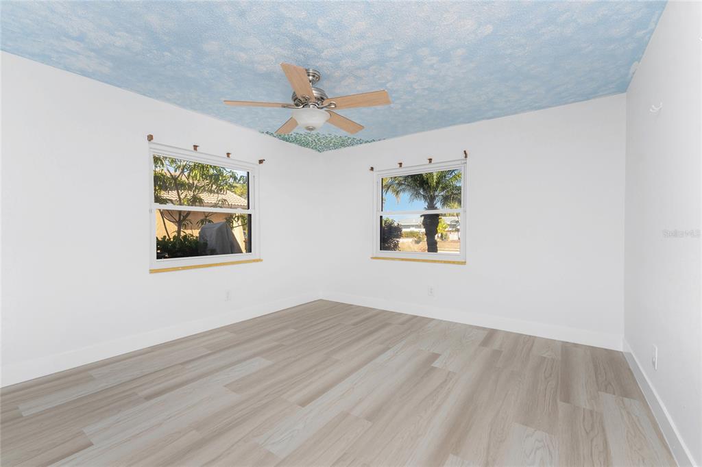 341 Severin Road Southeast Port Charlotte, FL 33952 - Photo 43 of 90 wooden floor in an empty room