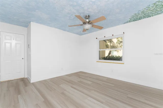 a view of a house with pool and sitting area