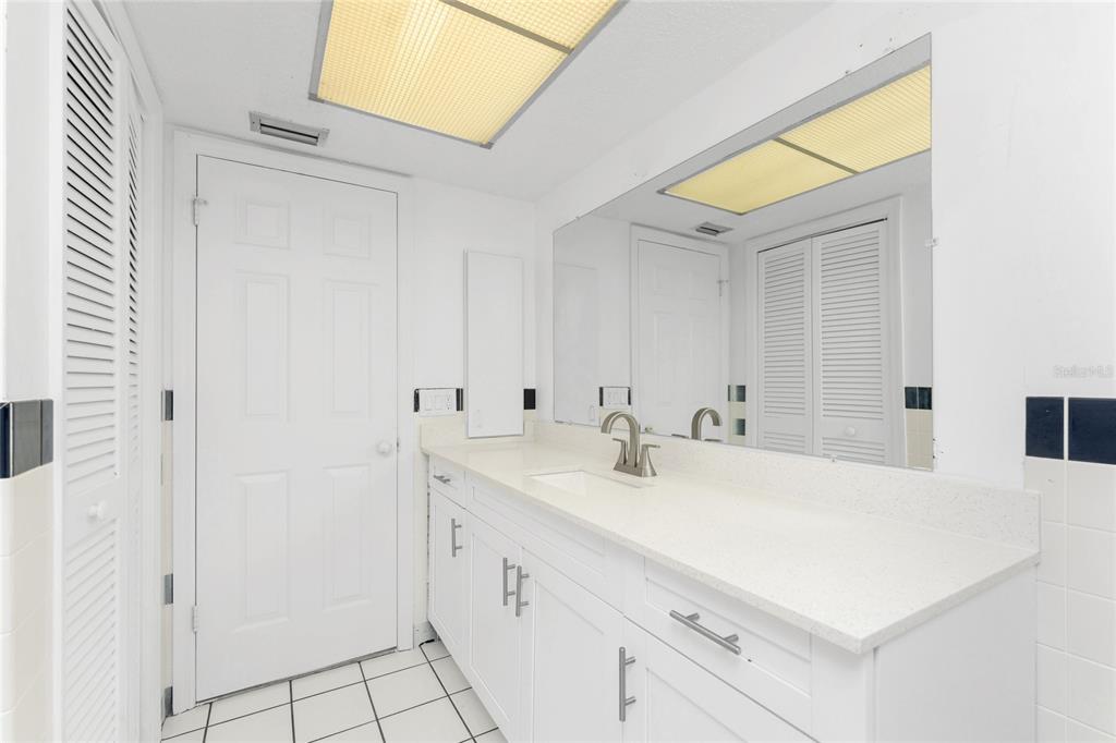 341 Severin Road Southeast Port Charlotte, FL 33952 - Photo 47 of 90 a bathroom with a sink and a mirror