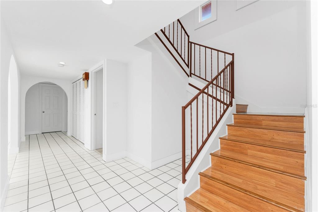 341 Severin Road Southeast Port Charlotte, FL 33952 - Photo 52 of 90 a view of entryway with wooden floor and stairs
