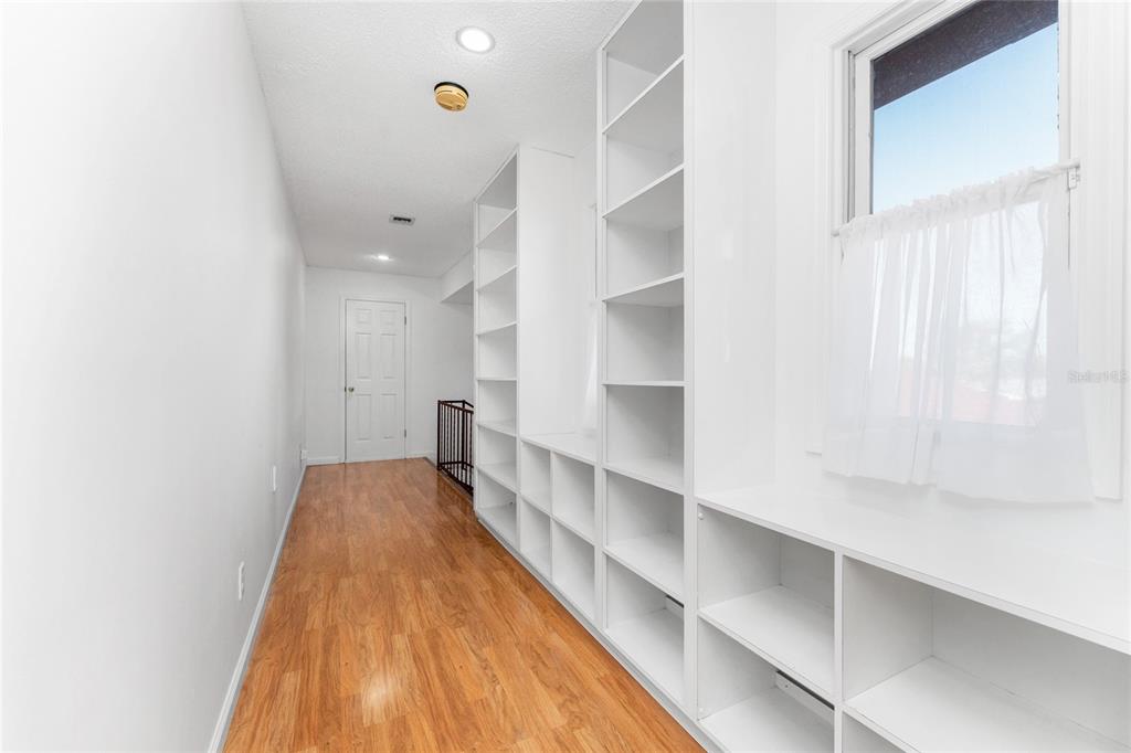 341 Severin Road Southeast Port Charlotte, FL 33952 - Photo 55 of 90 a hallway with cabinets