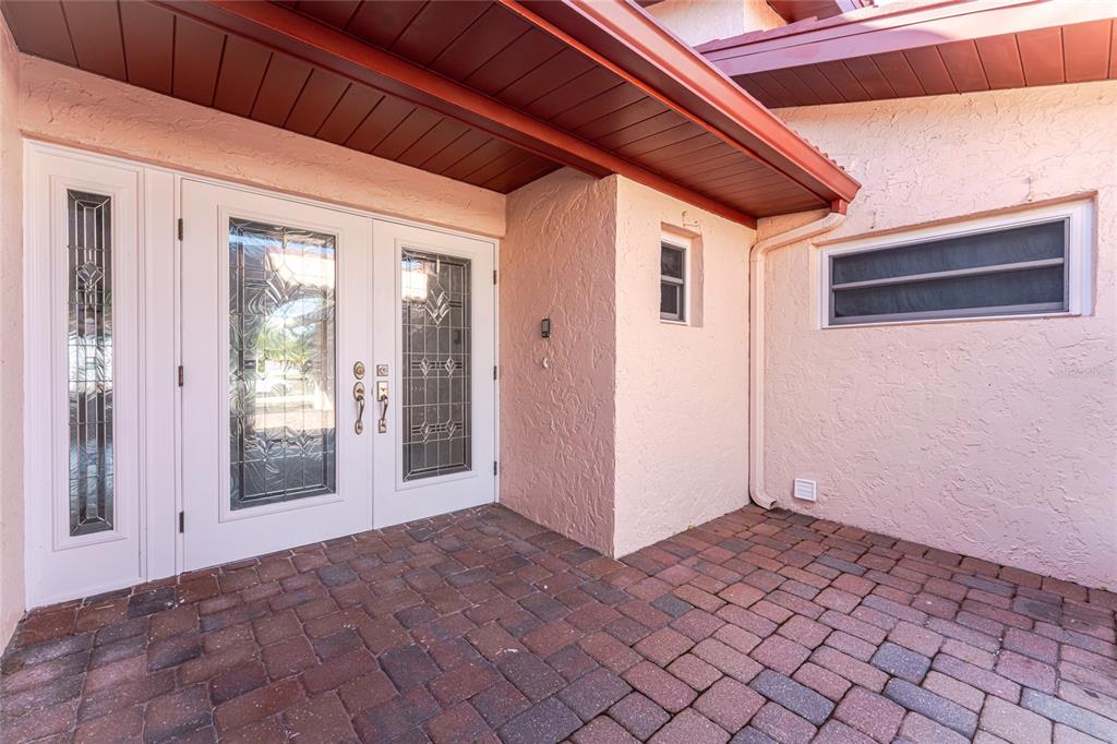 341 Severin Road Southeast Port Charlotte, FL 33952 - Photo 6 of 90 a view of a big room with wooden floor and windows