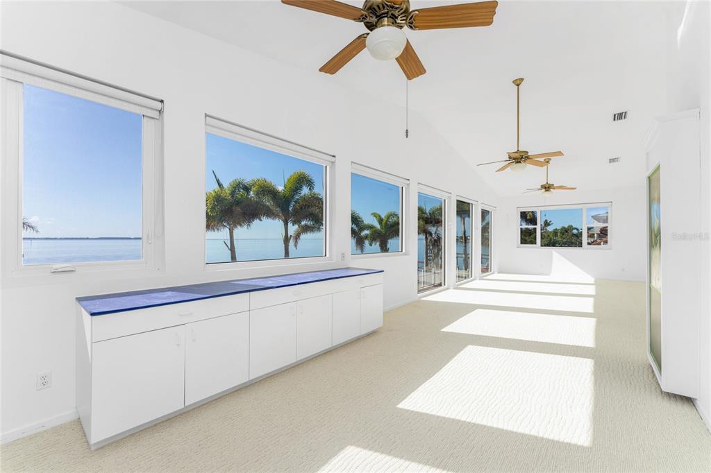 341 Severin Road Southeast Port Charlotte, FL 33952 - Photo 62 of 90 a view of a hallway with a large window and a chandelier