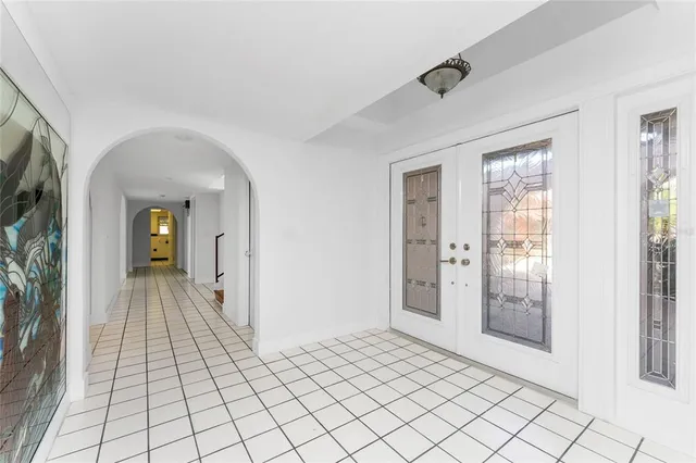 a view of a kitchen with furniture and wooden floor