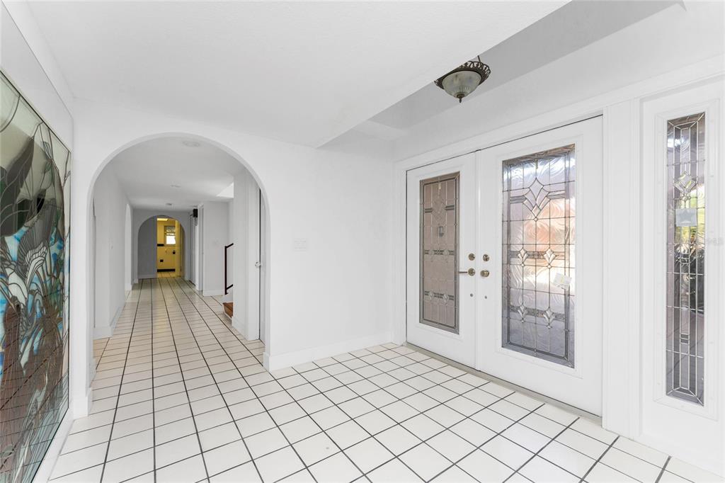 341 Severin Road Southeast Port Charlotte, FL 33952 - Photo 7 of 90 a view of a hallway view with wooden floor and living room