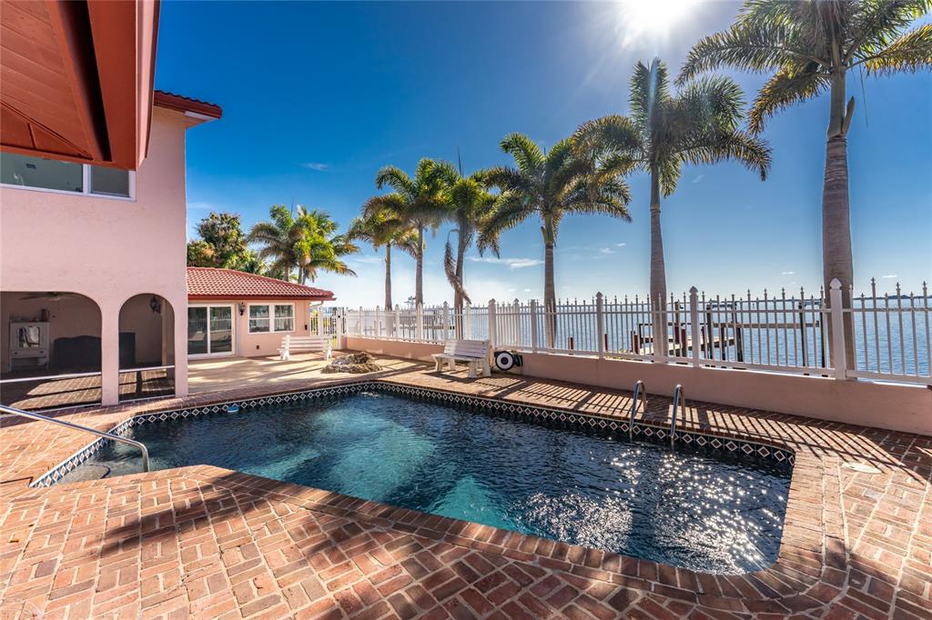 341 Severin Road Southeast Port Charlotte, FL 33952 - Photo 79 of 90 a view of swimming pool with a table and chairs