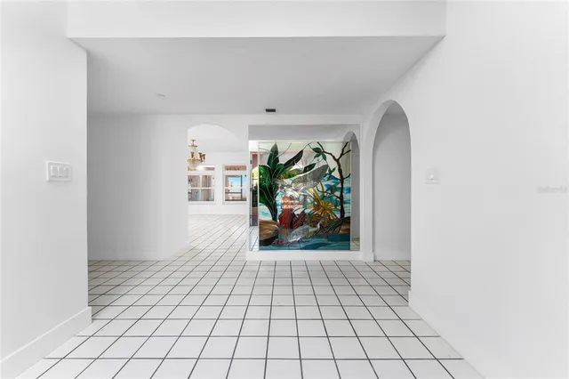 a kitchen with granite countertop white cabinets and sink