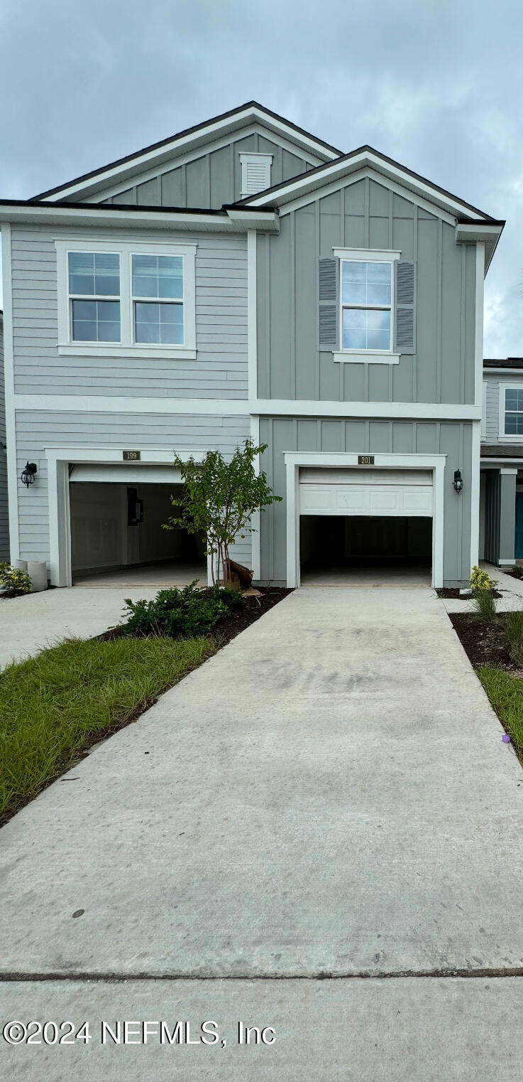 201 Seaport Breeze Road St. Augustine, FL 32095 - Photo 1 of 1 a front view of a house with a garden