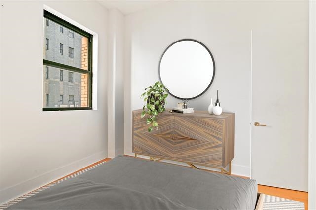 4 Beacon Way, Unit 222 Jersey City, NJ 07304 - Photo 3 of 20 a bathroom with a sink and a mirror