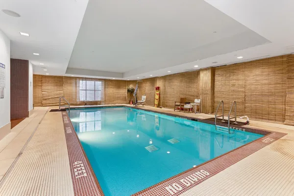 a kitchen with stainless steel appliances granite countertop a sink a counter top space and cabinets