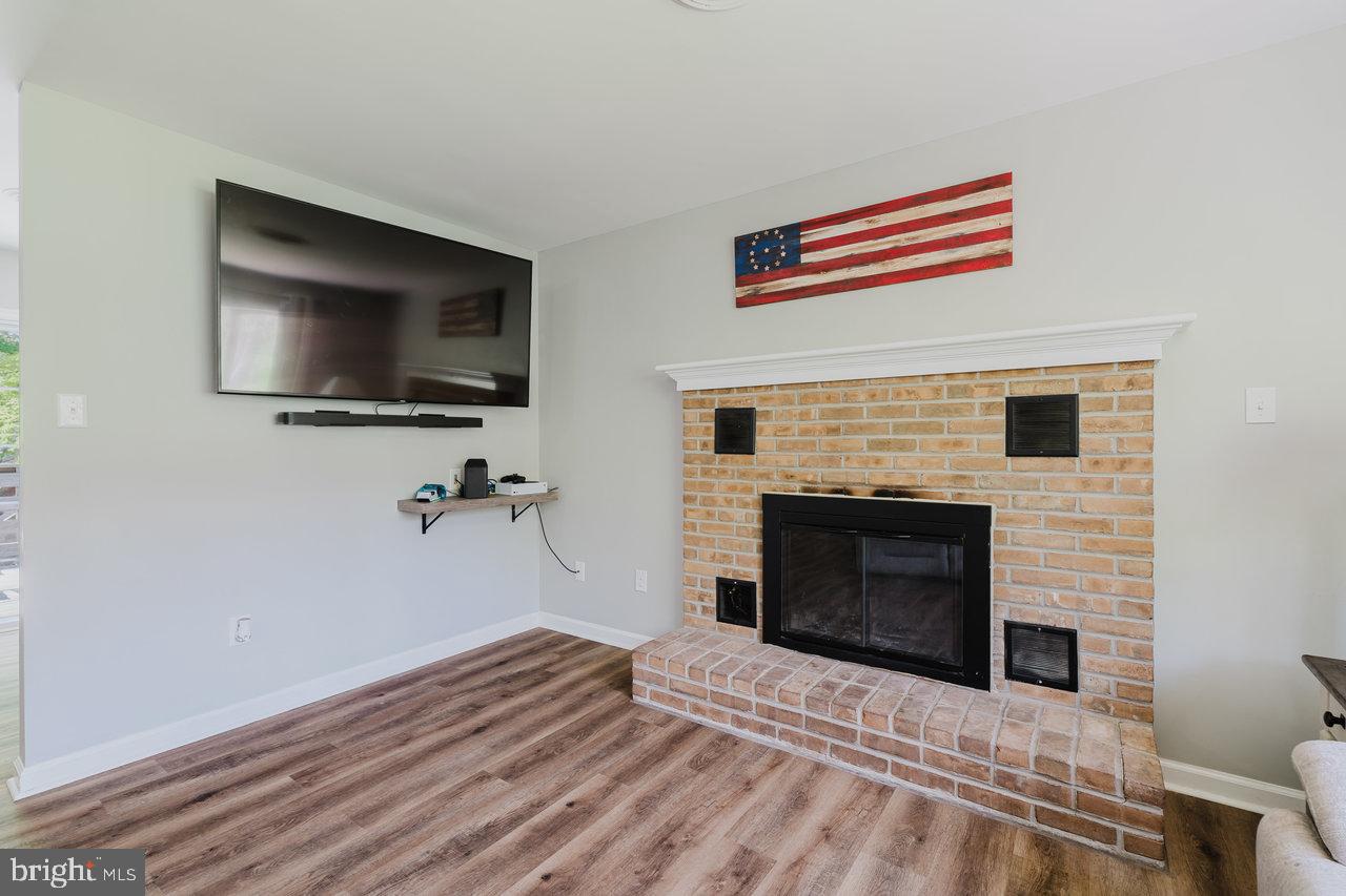 119 Canal Road Falling Waters, WV 25419 - Photo 11 of 66 a bedroom with furniture and a fireplace