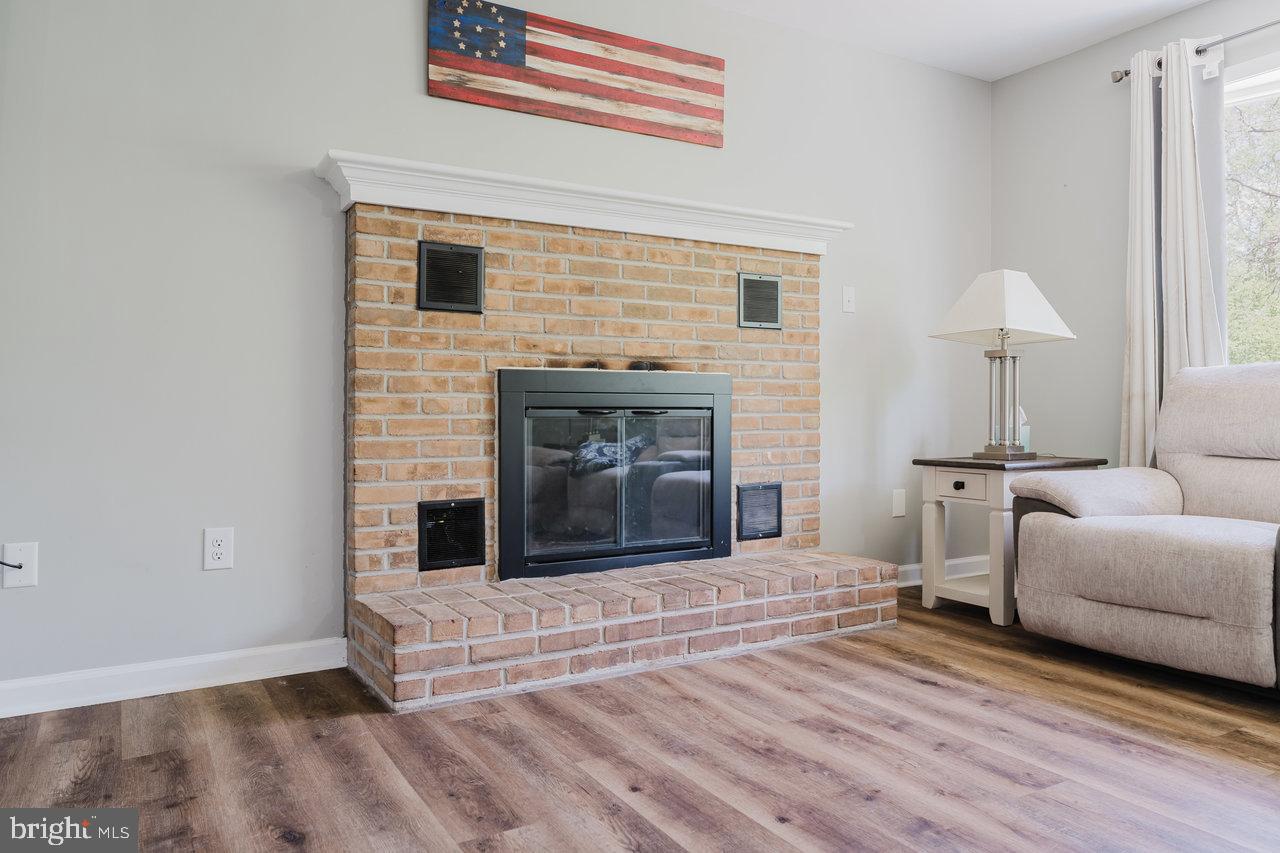 119 Canal Road Falling Waters, WV 25419 - Photo 12 of 66 a living room with furniture and a fireplace