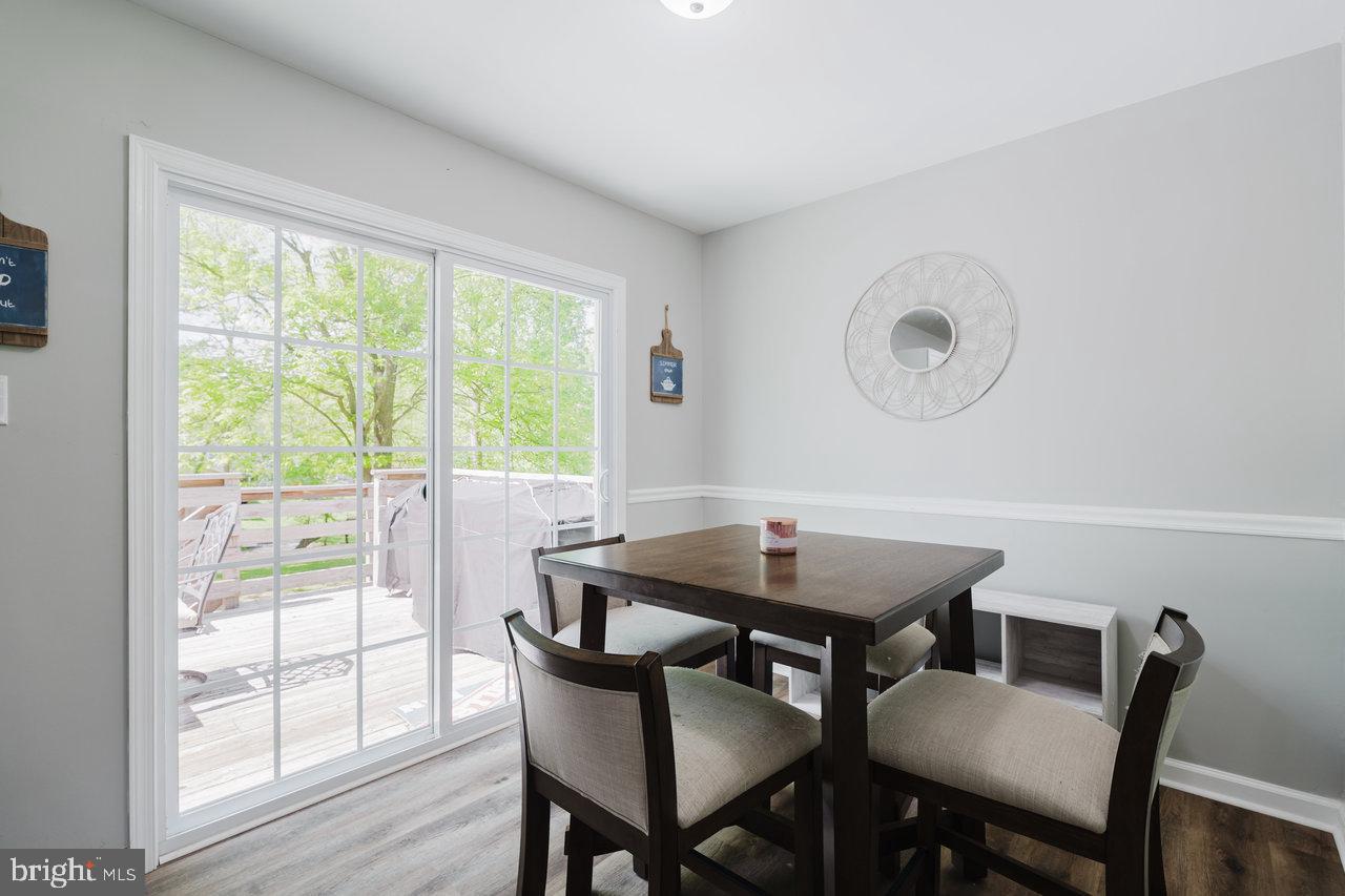 119 Canal Road Falling Waters, WV 25419 - Photo 13 of 66 a view of a dining room with furniture and wooden floor