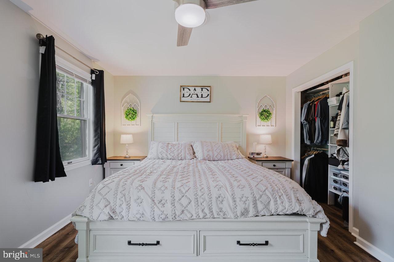 119 Canal Road Falling Waters, WV 25419 - Photo 21 of 66 a bedroom with a bed and a flat tv screen on dresser