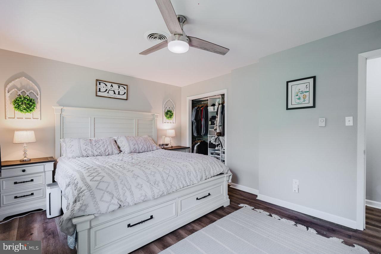 119 Canal Road Falling Waters, WV 25419 - Photo 23 of 66 a bedroom with a bed and a chandelier