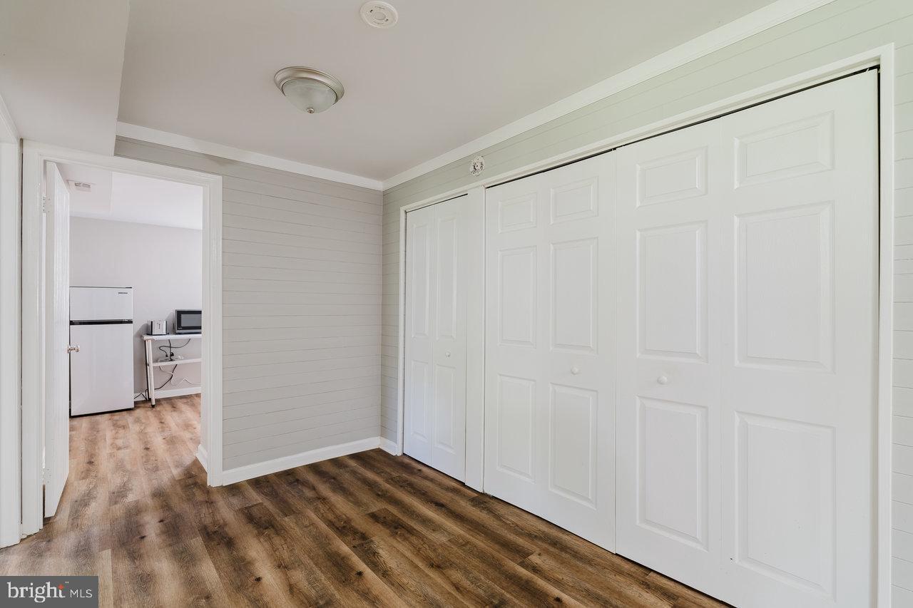 119 Canal Road Falling Waters, WV 25419 - Photo 29 of 66 a view of empty room with wooden floor and entryway