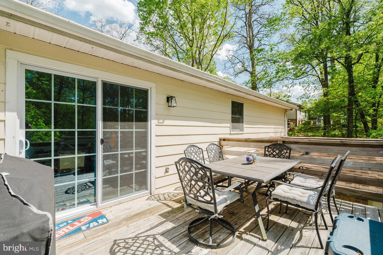 119 Canal Road Falling Waters, WV 25419 - Photo 56 of 66 a patio with table and chairs and potted plants