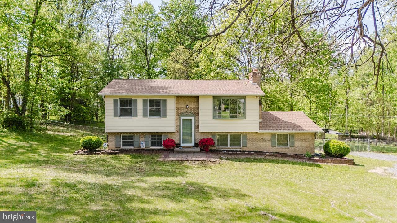 119 Canal Road Falling Waters, WV 25419 - Photo 61 of 66 a front view of a house with a yard table and chairs
