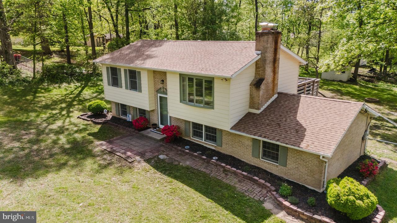 119 Canal Road Falling Waters, WV 25419 - Photo 62 of 66 a aerial view of a house with swimming pool next to a big yard