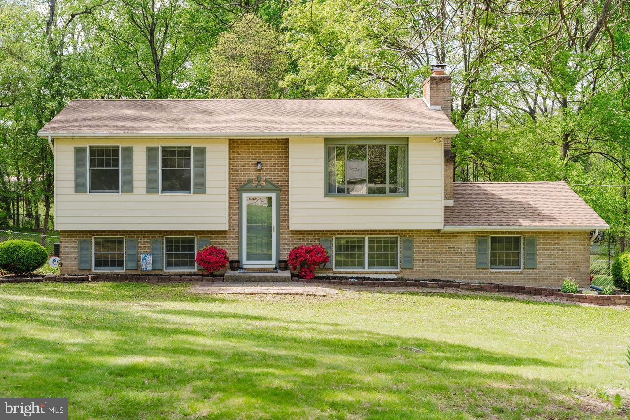 119 Canal Road Falling Waters, WV 25419 - Photo 63 of 66 a view of a white house with a large pool lawn chairs and a small yard