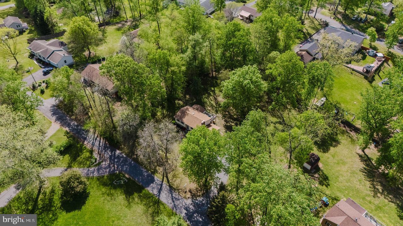 119 Canal Road Falling Waters, WV 25419 - Photo 64 of 66 an aerial view of residential house with outdoor space and trees all around
