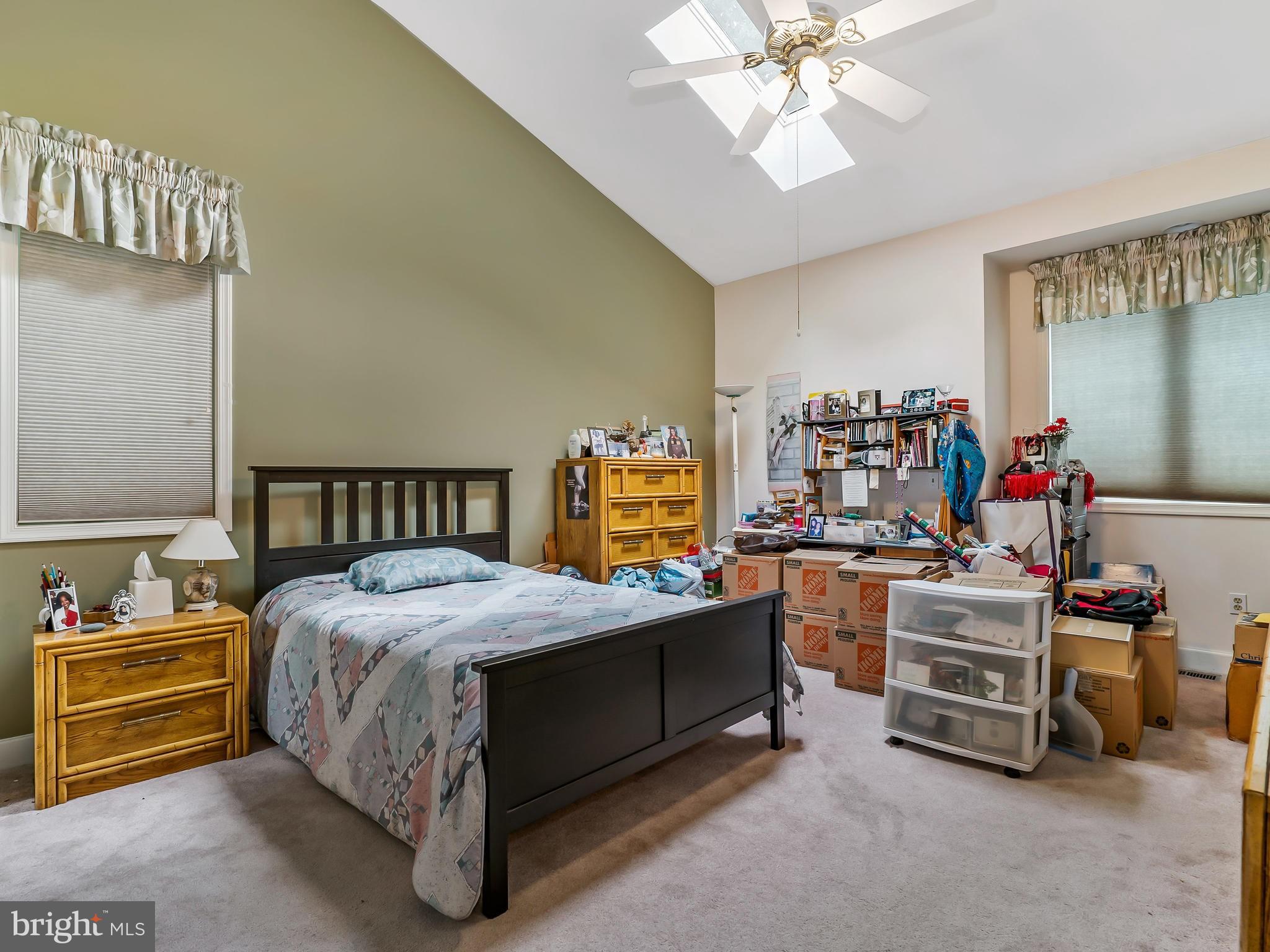 175 Norwood Road Silver Spring, MD 20905 - Photo 16 of 30 a bedroom with a bed and a chandelier