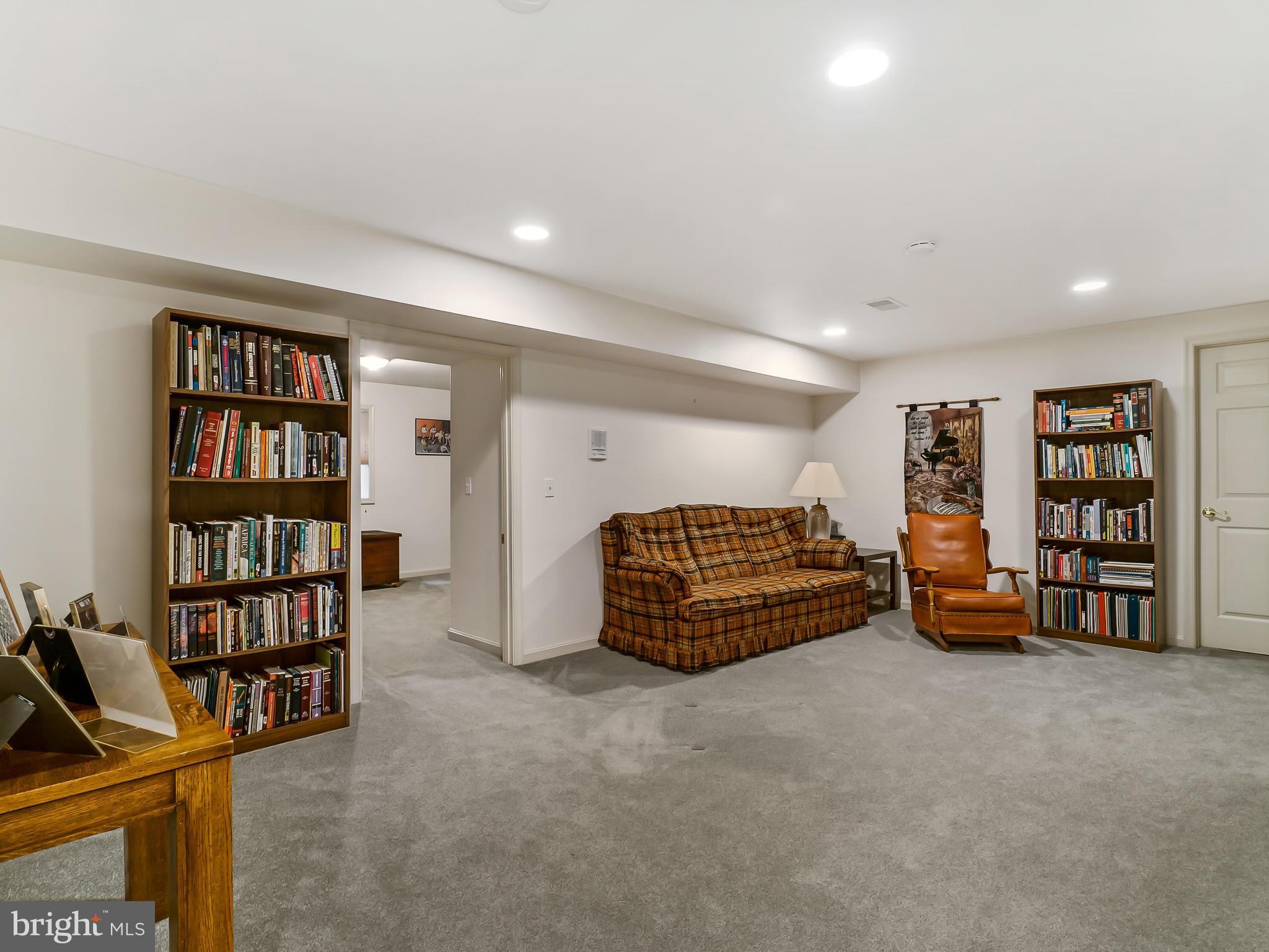 175 Norwood Road Silver Spring, MD 20905 - Photo 18 of 30 a bedroom with furniture and a book shelf