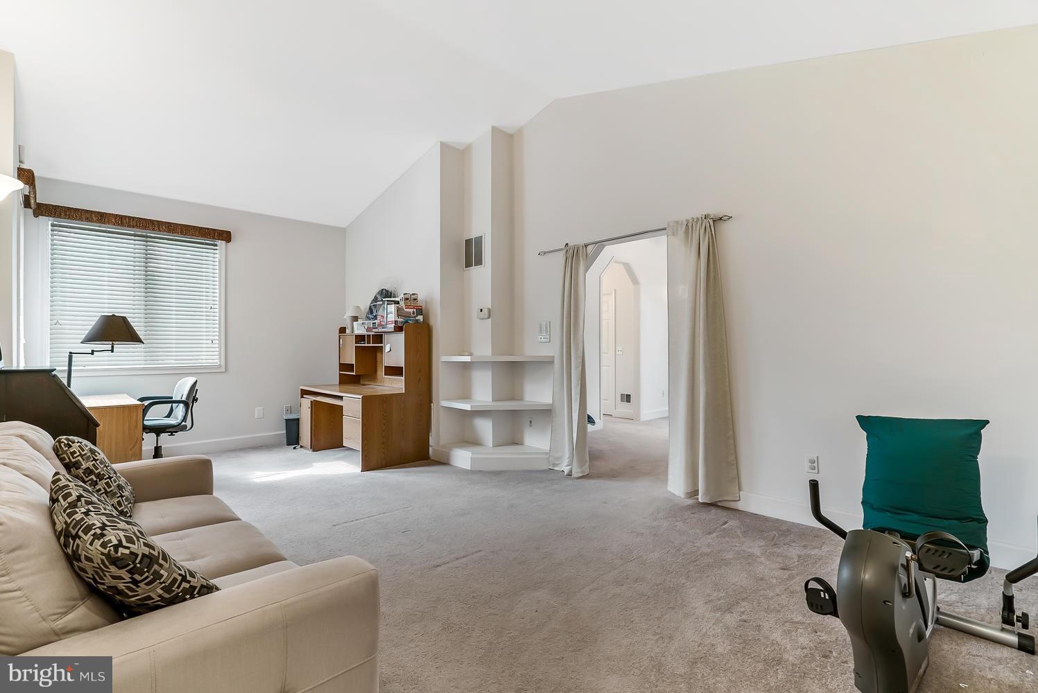 175 Norwood Road Silver Spring, MD 20905 - Photo 25 of 30 a living room with furniture and a flat screen tv