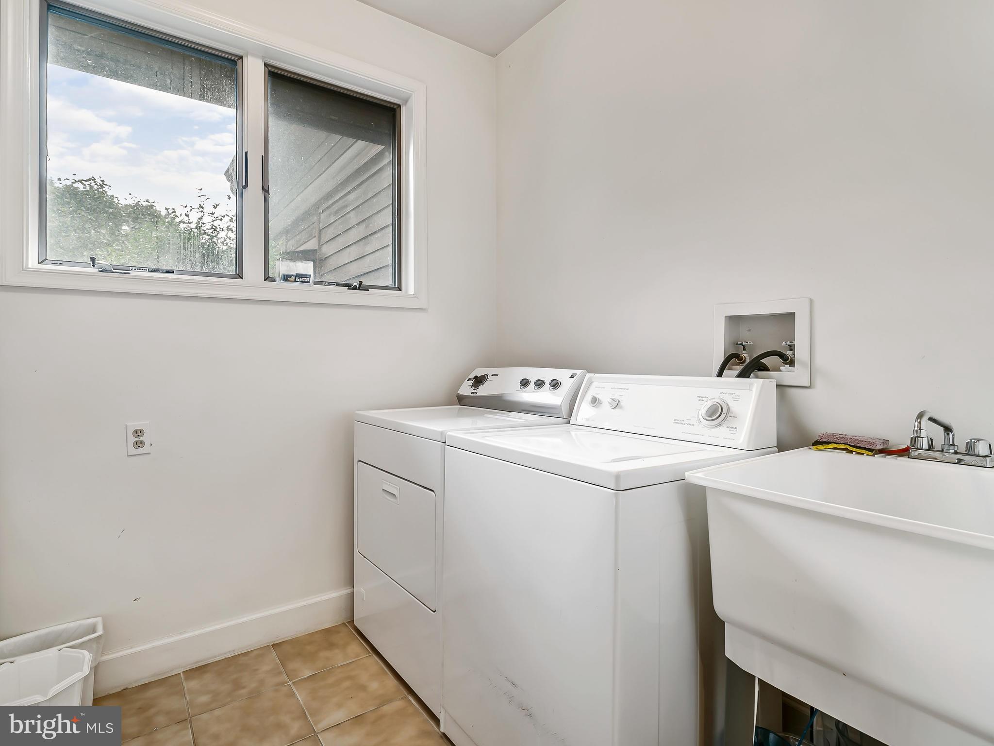 175 Norwood Road Silver Spring, MD 20905 - Photo 27 of 30 a utility room with dryer and washer