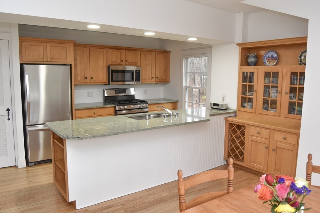 344 Flat Hills Road Amherst, MA 01002 - Photo 17 of 42 a kitchen with stainless steel appliances granite countertop a refrigerator and a stove top oven