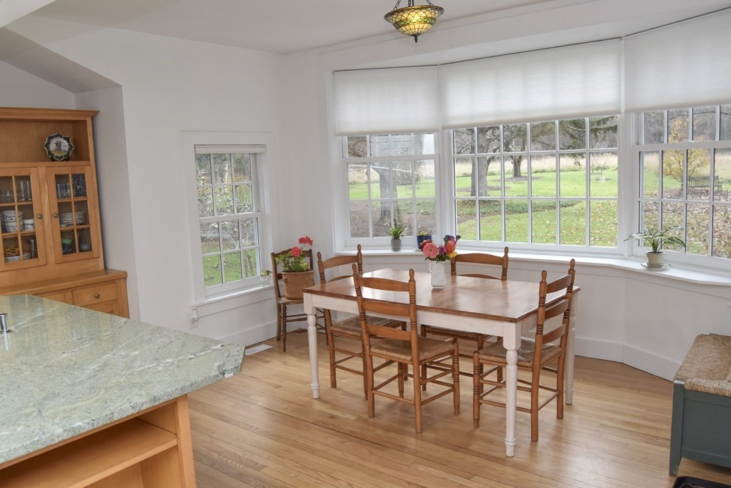 344 Flat Hills Road Amherst, MA 01002 - Photo 18 of 42 a view of a dining room with furniture and wooden floor