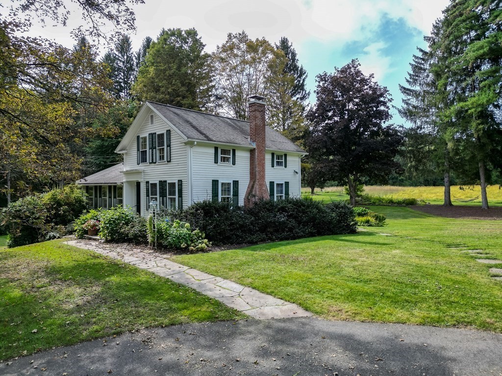 344 Flat Hills Road Amherst, MA 01002 - Photo 2 of 42 a front view of a house with a yard